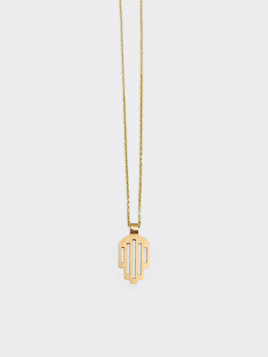 Hemi and Zo  Minimalist hamsa pendant necklace in gold on a light gray background