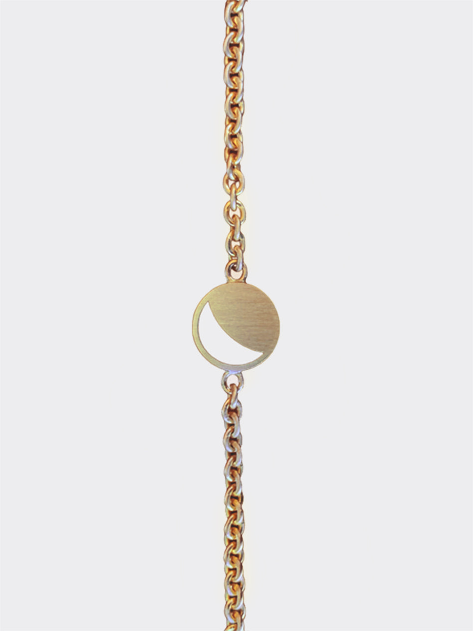 Hemi & Zo yellow gold Moon Phase bracelet displayed on a neutral background