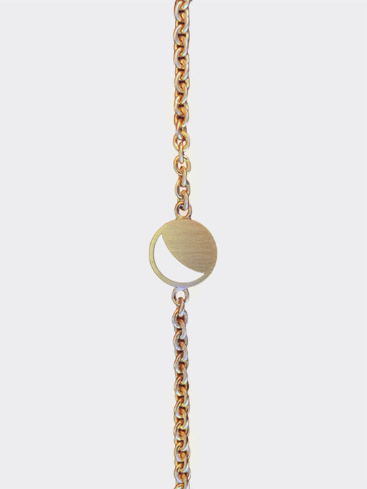 Hemi & Zo yellow gold Moon Phase bracelet displayed on a neutral background