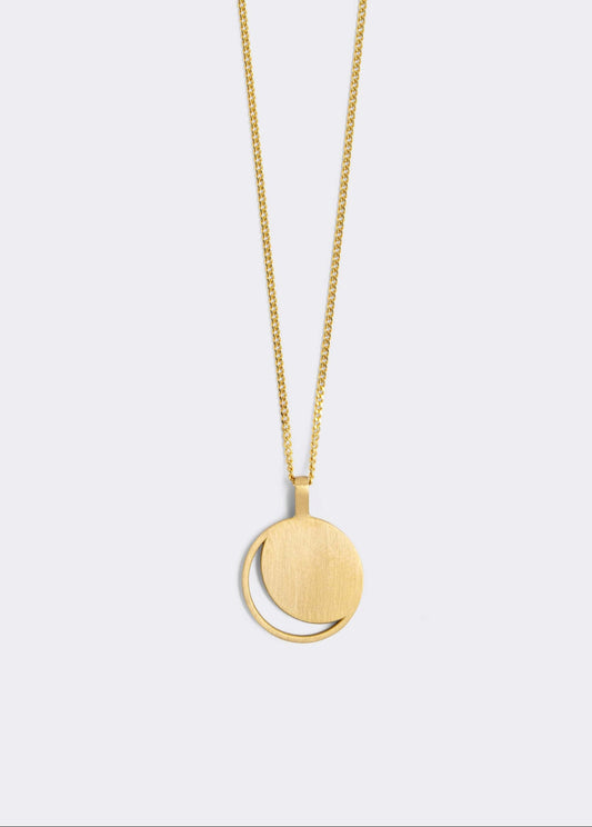 Hemi & Zo silver Moon Phase necklace with a large pendant, presented against a white background